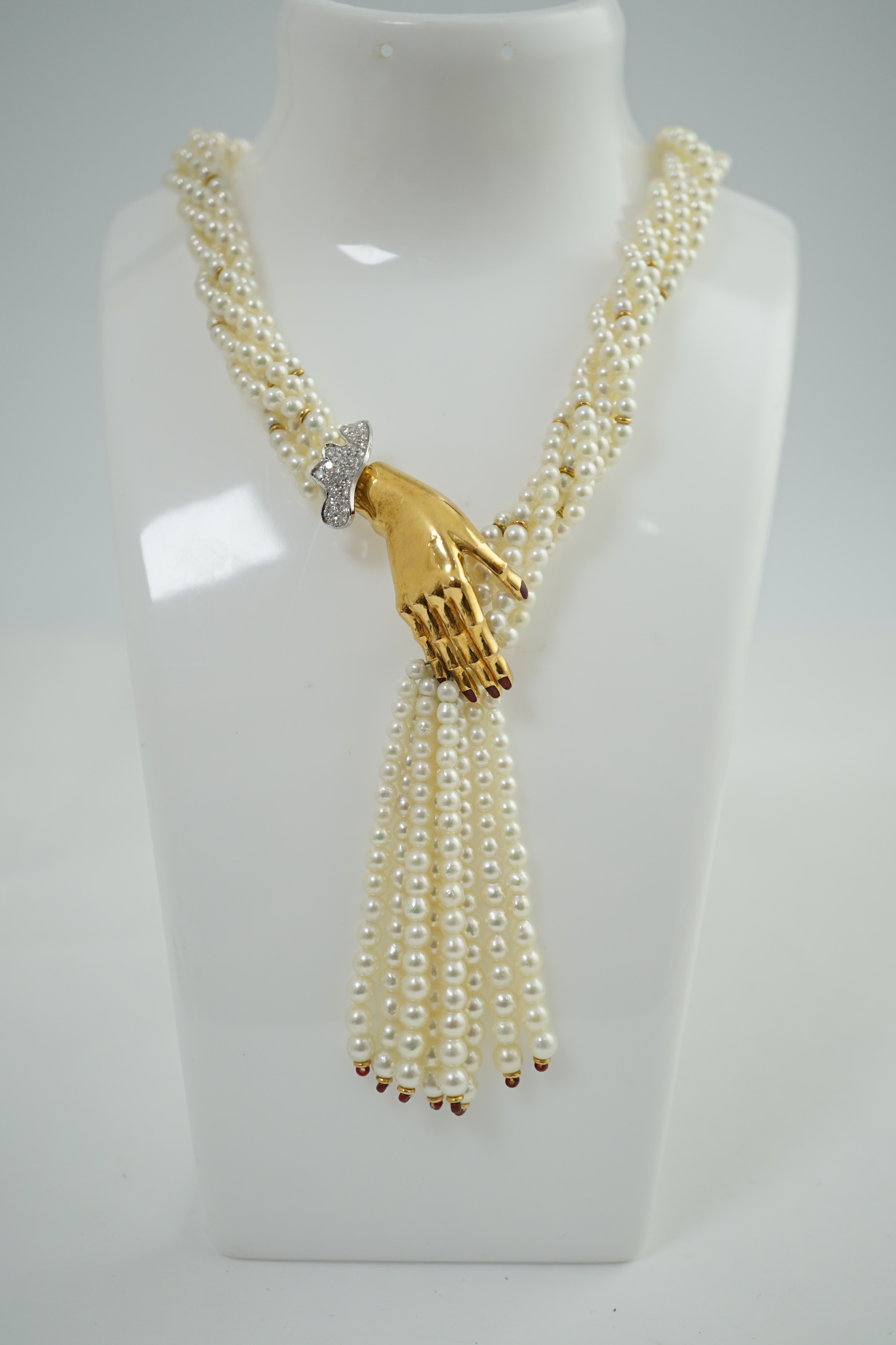 A modern cultured pearl torsade necklace, with gold and diamond cluster set hand clasp